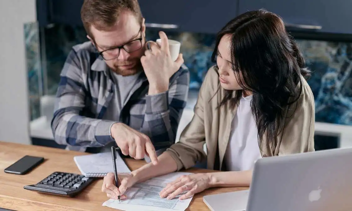 Image of a couple looking through documents