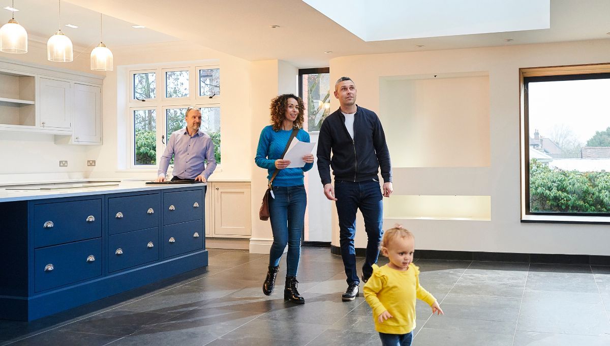 Couple and kid checking out new home