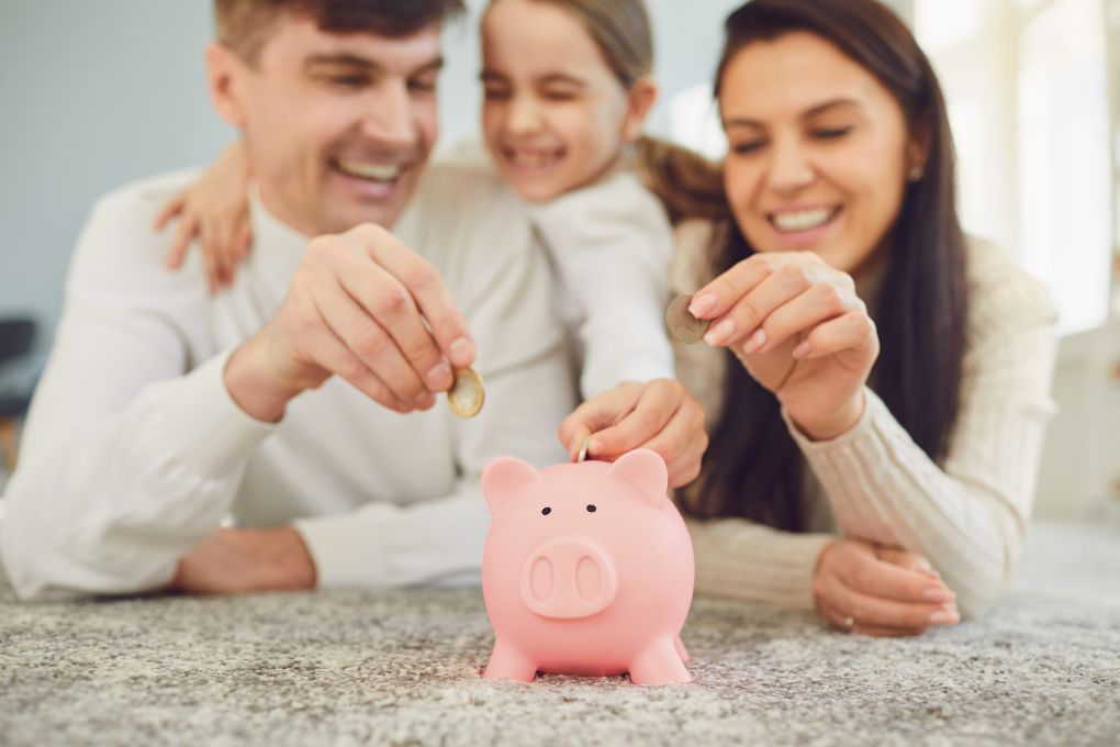 Image of Family using piggy bank